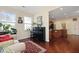 Cozy sunroom featuring hardwood floors and large windows offering picturesque views and natural light at 8592 Sentry Cir, North Charleston, SC 29420