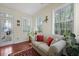 Charming sunroom with abundant natural light and a cozy seating area, ideal for relaxation at 8592 Sentry Cir, North Charleston, SC 29420