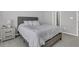 Bedroom with gray carpet, queen bed, and a bedside table at 87 Morning Song St, Summerville, SC 29485