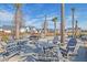 Relax and socialize in the community area, which offers picnic tables and lounge seating under palm trees at 87 Morning Song St, Summerville, SC 29485