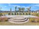Scenic pond with a fountain, surrounded by trees and manicured landscaping at 87 Morning Song St, Summerville, SC 29485