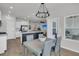 Eat-in kitchen and dining area featuring stainless steel appliances and seamless flow to living area at 87 Morning Song St, Summerville, SC 29485