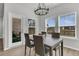 Dining room with chandelier, natural light, and backyard access at 87 Morning Song St, Summerville, SC 29485