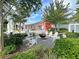 Inviting community fire pit area with Adirondack chairs and lush landscaping at 87 Morning Song St, Summerville, SC 29485