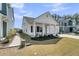 Beautiful house with a quaint front porch and landscaped front yard at 87 Morning Song St, Summerville, SC 29485