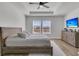 Serene main bedroom with a tray ceiling, hardwood floors, and a relaxing atmosphere at 87 Morning Song St, Summerville, SC 29485