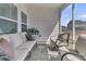 Relaxing screened porch with neutral outdoor seating, perfect for enjoying the outdoors at 87 Morning Song St, Summerville, SC 29485
