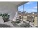 Inviting screened porch with cozy outdoor seating and view of the backyard at 87 Morning Song St, Summerville, SC 29485