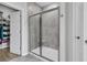 Bathroom tiled shower with glass doors and access to walk-in closet at 87 Morning Song St, Summerville, SC 29485