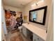 Bathroom features a large vanity, a decorative mirror and a shower with colorful curtain at 927 Dills Bluff Rd # 33, Charleston, SC 29412