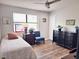 This cozy bedroom features hardwood floors and a ceiling fan for year-round comfort at 927 Dills Bluff Rd # 33, Charleston, SC 29412