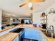 Open kitchen with blue cabinets, butcher block countertops, and access to the dining and living areas at 927 Dills Bluff Rd # 33, Charleston, SC 29412