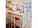 Charming kitchen with butcher block countertops, white cabinets, floating shelves, and updated appliances at 927 Dills Bluff Rd # 33, Charleston, SC 29412