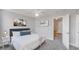 An airy bedroom featuring modern decor with artwork, a ceiling fan, and a comfy bed with a grey headboard at 947 E Estates Blvd # C, Charleston, SC 29414