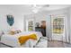 Comfortable bedroom featuring natural light, ceiling fan, and closet space at 947 E Estates Blvd # C, Charleston, SC 29414