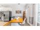 Eat-in kitchen featuring light colored walls, stainless steel appliances, and a modern dining set at 947 E Estates Blvd # C, Charleston, SC 29414