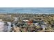 Scenic aerial view of waterfront home with tree coverage near beach at 1009 Seacrest Ln, Folly Beach, SC 29439