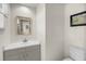 Clean half bathroom features modern fixtures, vanity, and a neutral color scheme at 1009 Seacrest Ln, Folly Beach, SC 29439