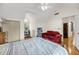 Bedroom with hardwood floors, a sloped ceiling, and features a cozy sitting area with a red sofa at 1009 Seacrest Ln, Folly Beach, SC 29439