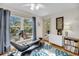 Bedroom with a large window showcasing outdoor scenery, exercise equipment, and natural light at 1009 Seacrest Ln, Folly Beach, SC 29439