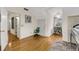 Bedroom with hardwood floors, a green chair, and a storage closet on the right and left of the image at 1009 Seacrest Ln, Folly Beach, SC 29439