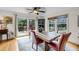 Charming dining room with a rustic wooden table, stylish chairs, and a view of the water at 1009 Seacrest Ln, Folly Beach, SC 29439