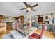 Open dining area with a wooden table, bench seating, and a view of the living room and kitchen at 1009 Seacrest Ln, Folly Beach, SC 29439