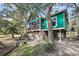 Charming home featuring a screened porch and inviting outdoor space at 1009 Seacrest Ln, Folly Beach, SC 29439