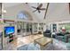 Spacious living room with vaulted ceilings, large windows, and comfortable seating at 1009 Seacrest Ln, Folly Beach, SC 29439