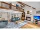 Open-concept living room with fireplace, high ceilings, and a cozy seating area at 1009 Seacrest Ln, Folly Beach, SC 29439
