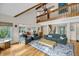 Bright and airy living room with hardwood floors, fireplace, and a view of the dining area at 1009 Seacrest Ln, Folly Beach, SC 29439