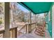 Inviting porch with wooden rocking chairs and a view of the lush surroundings at 1009 Seacrest Ln, Folly Beach, SC 29439