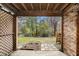 Outdoor patio provides a view of the pond and trees, with lattice and stone pavers at 102 Brush Blvd, Goose Creek, SC 29445