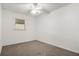 Carpeted bedroom with a ceiling fan and a window at 102 Brush Blvd, Goose Creek, SC 29445