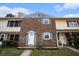 Charming townhome featuring a brick facade and a well-lit front entrance, perfect for a cozy neighborhood feel at 102 Brush Blvd, Goose Creek, SC 29445