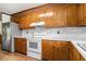 Functional kitchen featuring wood cabinets, white countertops, and modern appliances, ideal for home cooking at 102 Brush Blvd, Goose Creek, SC 29445