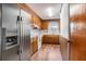 Open kitchen features stainless steel refrigerator and white countertops at 102 Brush Blvd, Goose Creek, SC 29445