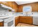 Classic kitchen featuring wood cabinetry, a stainless steel sink, and a window offering natural light at 102 Brush Blvd, Goose Creek, SC 29445