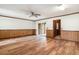 Spacious living room with hardwood floors, wood paneling, and natural light, creating a cozy atmosphere at 102 Brush Blvd, Goose Creek, SC 29445