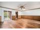 Bright living room featuring hardwood floors and sliding glass doors offering a view of the outdoor space at 102 Brush Blvd, Goose Creek, SC 29445