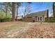 Backyard with mature trees, wood fence, air conditioning unit, and a built-in grill at 103 York Pl, Goose Creek, SC 29445