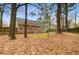 A spacious backyard featuring mature trees and a well-maintained lawn offering privacy at 103 York Pl, Goose Creek, SC 29445