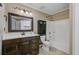 Bathroom with a dark wood vanity, modern faucet, white counters, and bathtub with shower at 103 York Pl, Goose Creek, SC 29445