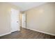 Cozy bedroom with wood floors, featuring neutral walls, and closet space for easy organization and storage at 103 York Pl, Goose Creek, SC 29445