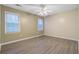 Inviting bedroom with hardwood floors, neutral colored walls, two windows, and a ceiling fan at 103 York Pl, Goose Creek, SC 29445