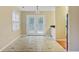 Bright dining area features tile flooring, natural light from windows, and double doors leading outside at 103 York Pl, Goose Creek, SC 29445