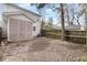 Backyard view of the home showing screen porch and fencing around the yard at 104 Chemistry Cir, Ladson, SC 29456