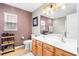 Bathroom featuring double sinks, wood cabinetry, and a large mirror at 104 Chemistry Cir, Ladson, SC 29456