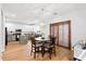 Bright dining room with a decorative light fixture adjacent to the modern kitchen area at 104 Chemistry Cir, Ladson, SC 29456