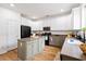 Spacious kitchen featuring an island, stainless steel appliances, and white and grey custom cabinets at 104 Chemistry Cir, Ladson, SC 29456